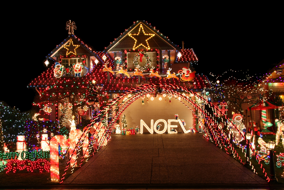 A house shining bright with excessive holiday decorations, including lights