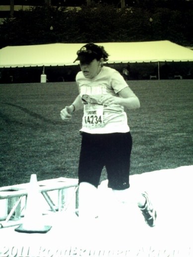 crossing the finish line of my first half-marathon