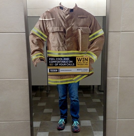 A turnout jacket cling on a bathroom mirror